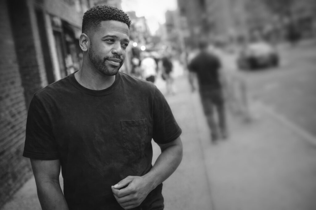 Candid street portrait of Luca Haunsby walking through the city